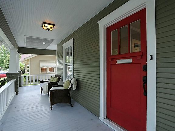 The original and cheery front door welcomes you and your guests in from the front porch.
