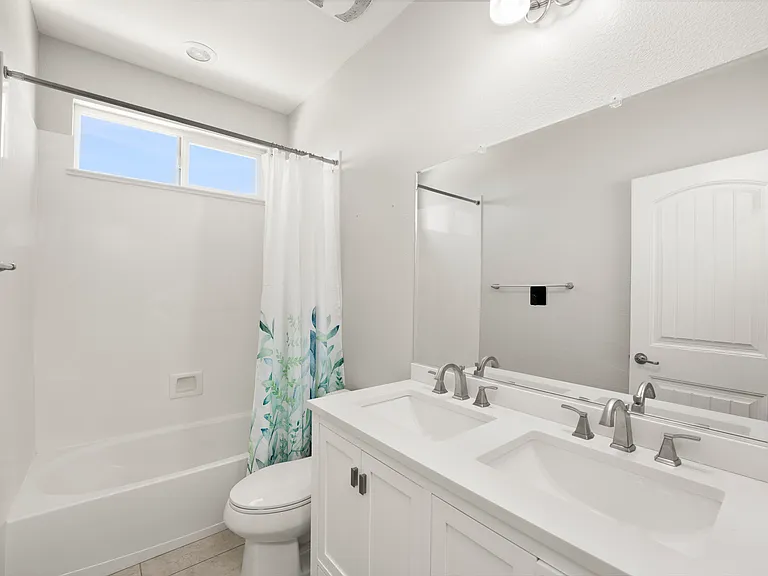 Upstairs bathroom number 2 with double sink.