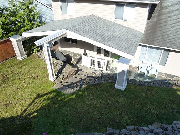 View of the backyard & patio from the cabana. The roof has recently been cleaned & treated-3 year gu