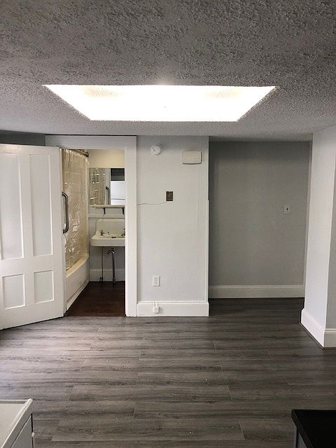 view from kitchen, bath and entrance