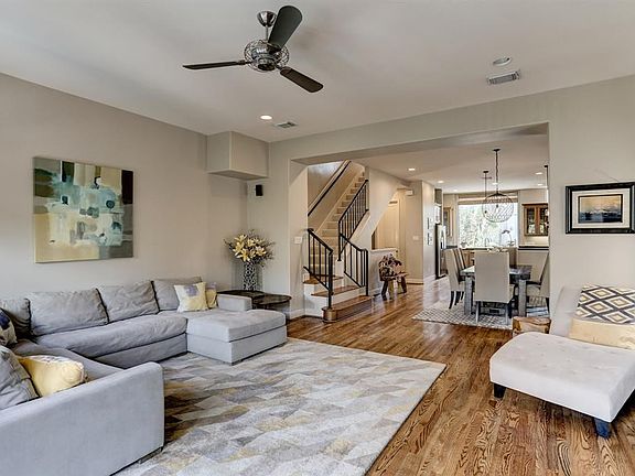 Living room gently opens to the dining and kitchen areas.