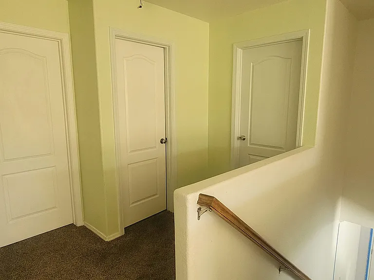 Left door bedroom with trees painted. Middle door is full bathroom. Right door Light Blue Room Recently painted.