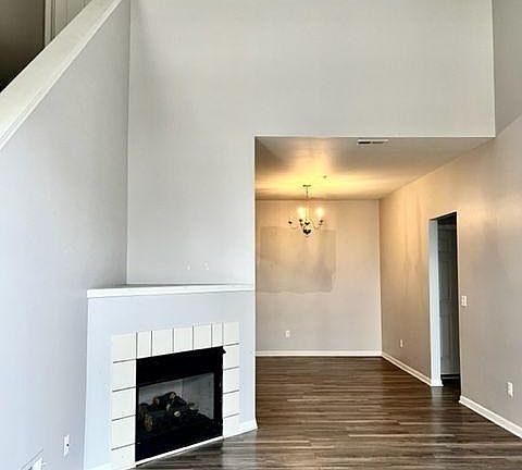 Living area with gas fireplace and soaring 2 story ceiling