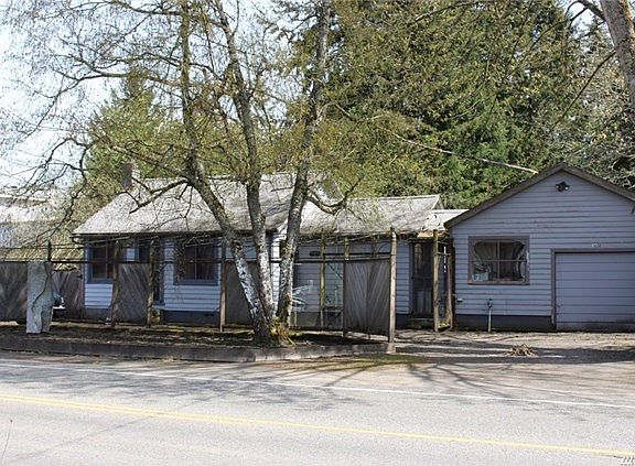 Front view of the house...1 bedroom, 2 baths, home with propane heat and shop space.  The septic has been pumped and paper work submitted to the County to complete the Time Of Transfer.