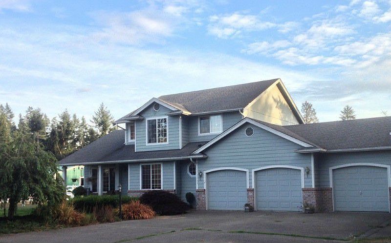 Equestrian Community a picture perfect setting for this well maintained 2 story home overlooking pastures nestled on 1.1 horse acre. Features dramatic entry, formal living & dining room, 3 good sized bedrooms 2.5 baths. Chef’s kitchen with island, eat in nook, adjacent family room with fireplace, overlooking private back yard. Main floor office/den and laundry room off attached 3 car garage with additional detached garage for a total of 6. The detached garage has room to gather. Equipped with pellet stove, fridge & cabinets & cable. It is great for a media room with plenty of space for workshop/workbench, with tall door garage with attached two carport area parking & separate electrical panel. Home is self contained, on septic system, private well, with central air conditioning & is wired for generator. This lovely property is a great value with convenient close in location, near all amenities, shopping, casual & fine dining, public transportation, Lake easy access to freeways.