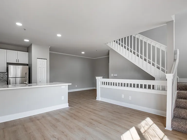 Enjoy a spacious, open-concept living area with updated flooring and a cozy fireplace.