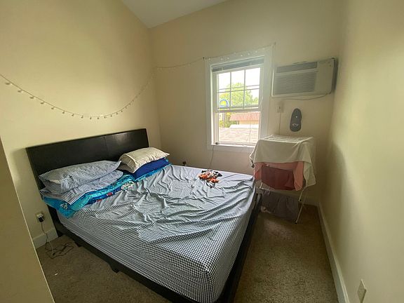 AC wall unit in bedroom