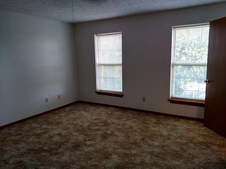 Main bedroom looking out at windows.