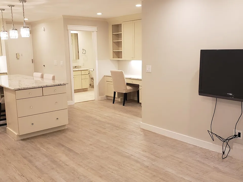 Open concept with kitchen, living and, desk area