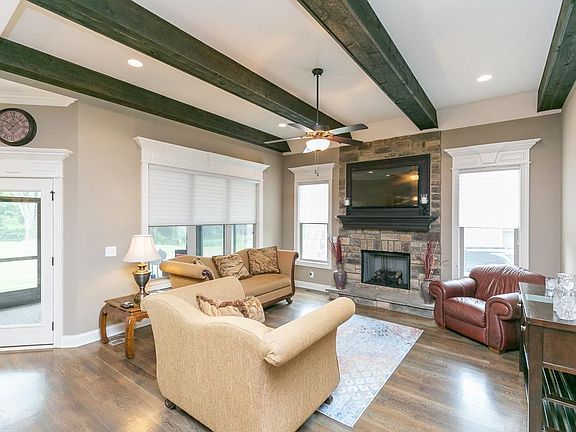 Wonderful living room with fireplace is great for gathering or just enjoying a quiet evening at home.