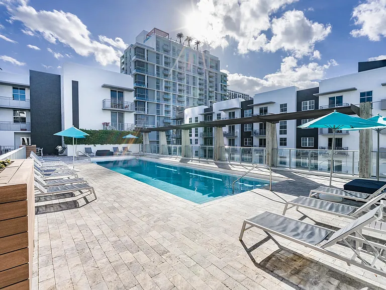 Rooftop pool with spacious sundeck at Modera Douglas Station apartment homes in Miami, FL.