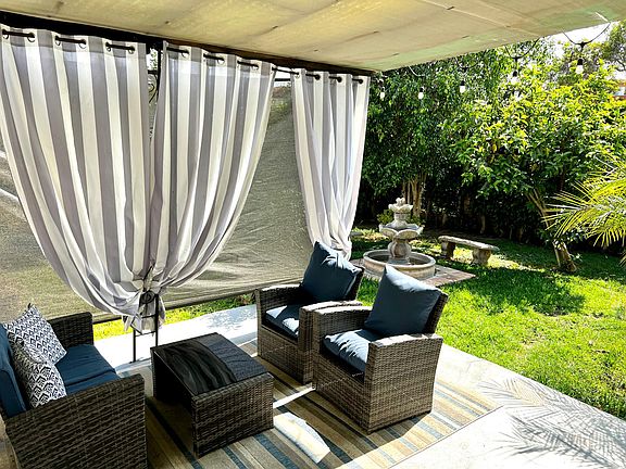 Current view with sun shades up and patio furniture