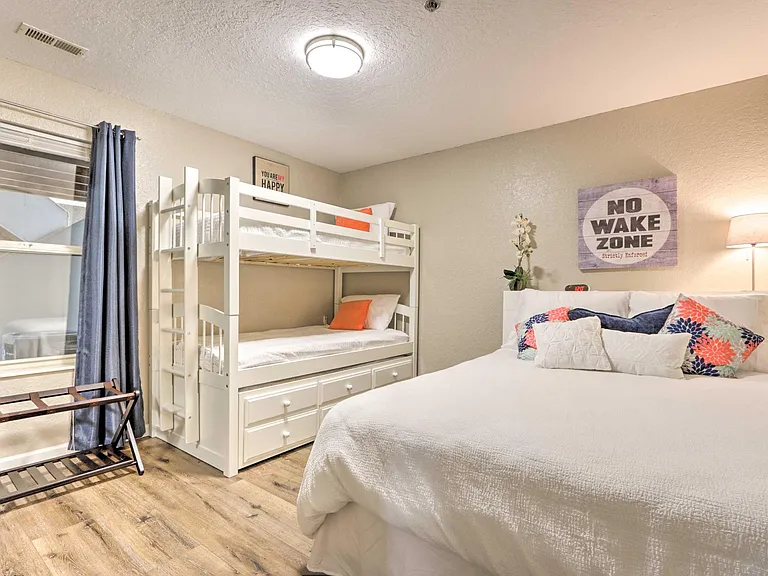 Twin bunk beds with a trundle, a queen bed and an additional memory foam roll-away twin