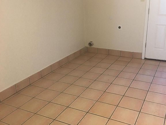 REAR OF LIVING AREA, DOOR TO BACK FENCED PATIO