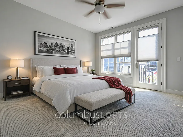 main level - master bedroom suite, which has windows and French door to private rear balcony