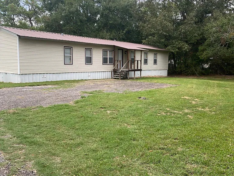 Front of home with yard.