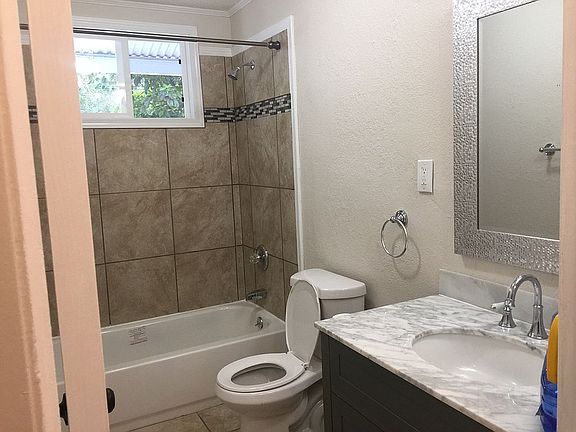 Marble vanity top, tiled tub