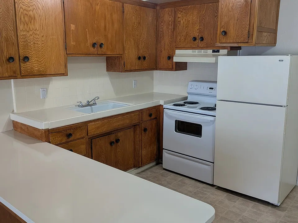 Kitchen with Stove, Refrigerator, Disposal