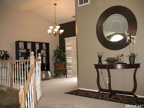 The dining room overlooks the living room.  It also features a sliding door to the back deck.