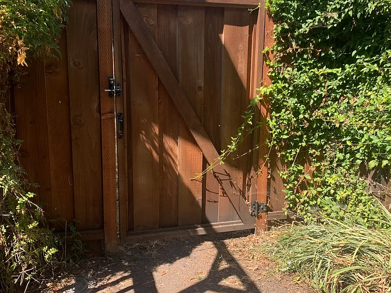 Locked Gated entrance to back yard