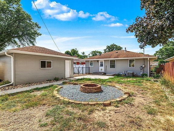 A spacious, fully fenced backyard with a fire! It is designed for unwinding, sharing stories, and enjoying good company.