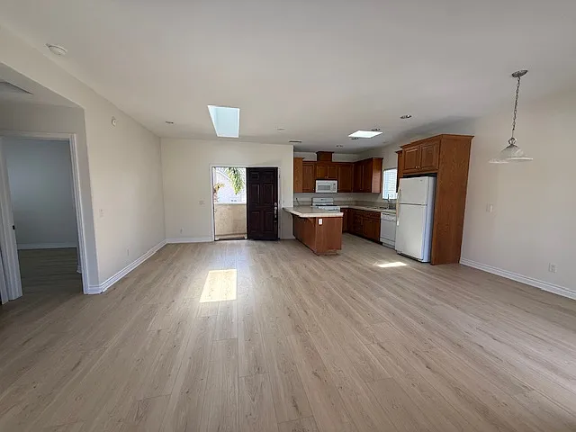 Living room, dining room, kitchen from balcony