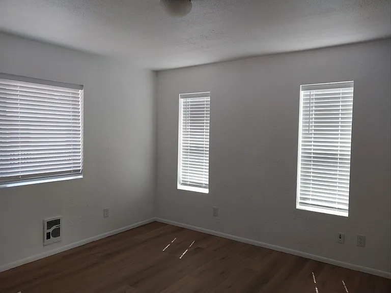 Lots of windows and light in living/dining area