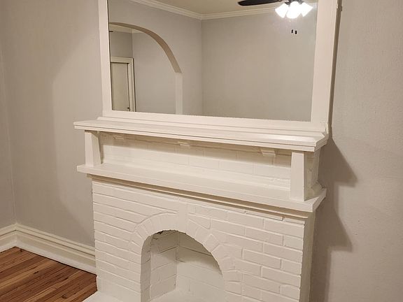 Decorative fireplace and mirror in the front room