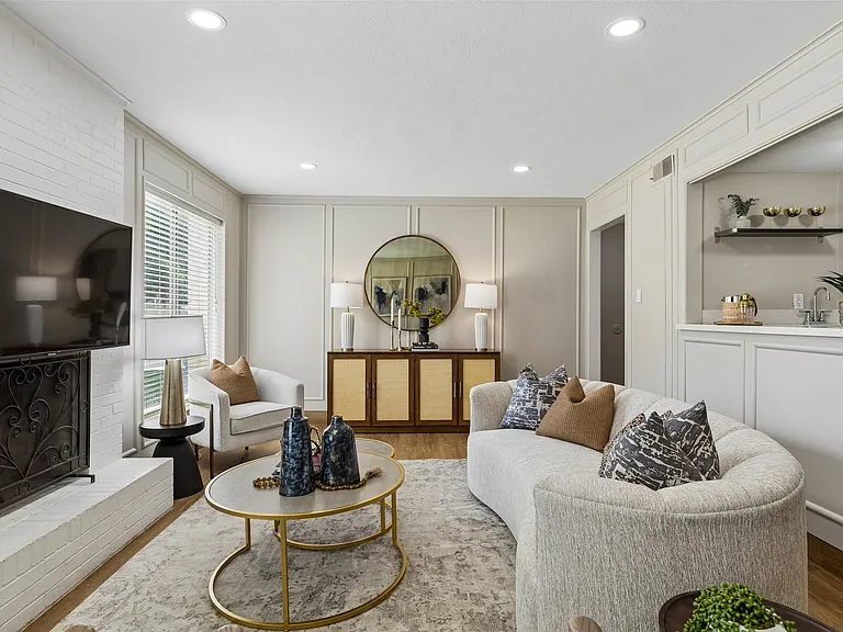 Living area featuring recessed lighting, a white brick fireplace, wood-finish flooring, and a built-in wet bar with shelving
