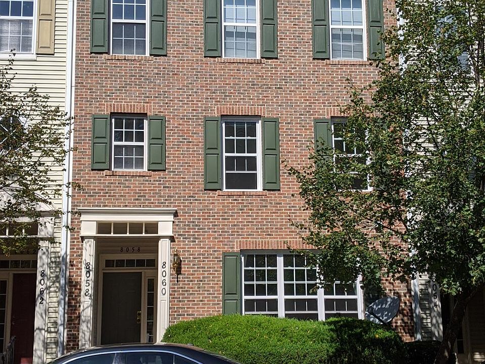 Front side of condo with stairs leading up to portico area. First and second floors are included in this condo. (Third and fourth floors are separate condo).