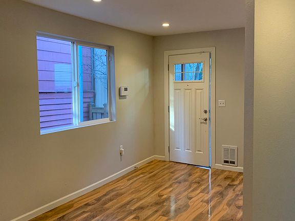 From Kitchen looking towards front door. There are now blinds on all the windows.