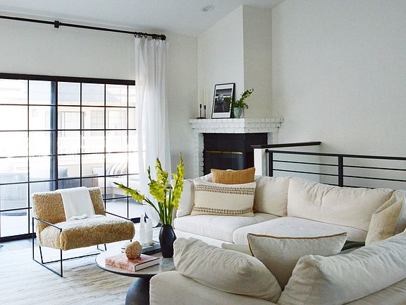 Comfy couch and corner fireplace