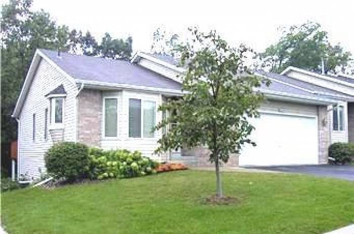 End unit facing woods.