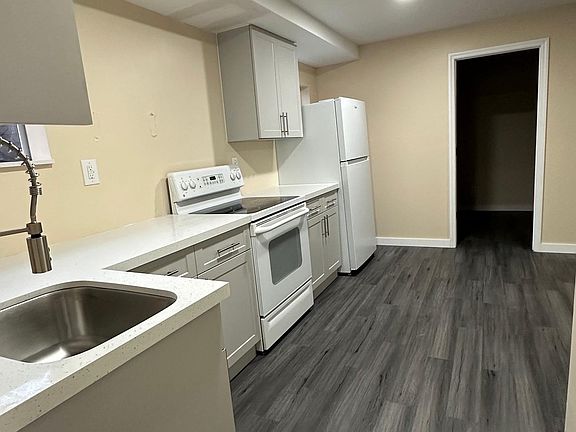 guest room is to the right of the kitchen