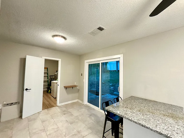 LAUNDRY ROOM VIEW FROM KITCHEN