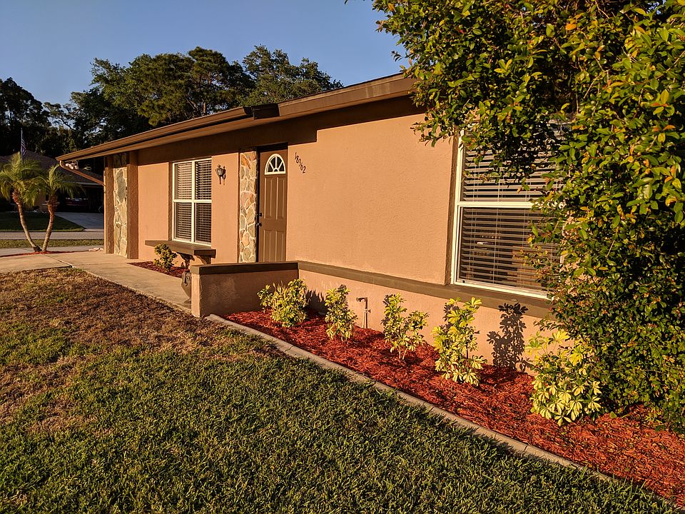 Bathed in afternoon light, the house has a clean and pleasant curb appeal.