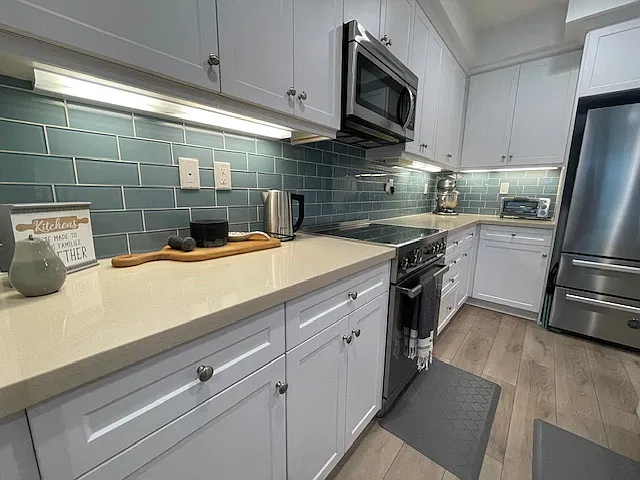 Elevated appliances, Baker's favorite electric mixer, toaster oven, electric kettle and extra storage,