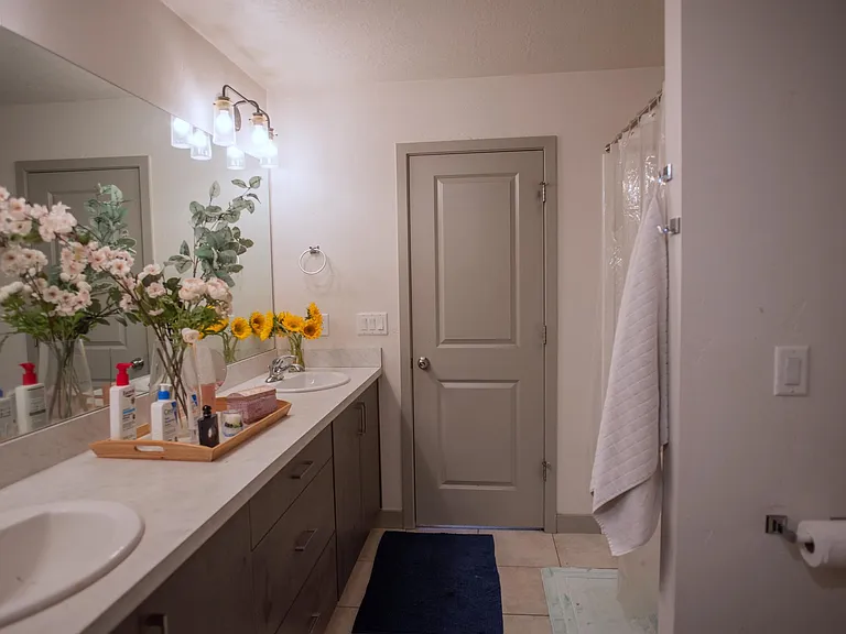 Master bathroom - tub and bathroom on the right; sinks on the left