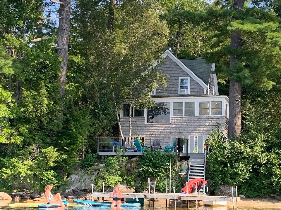 House taken from lake, showing new deck.