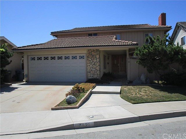 Tiled roof, dual paned windows, roll up garage door.