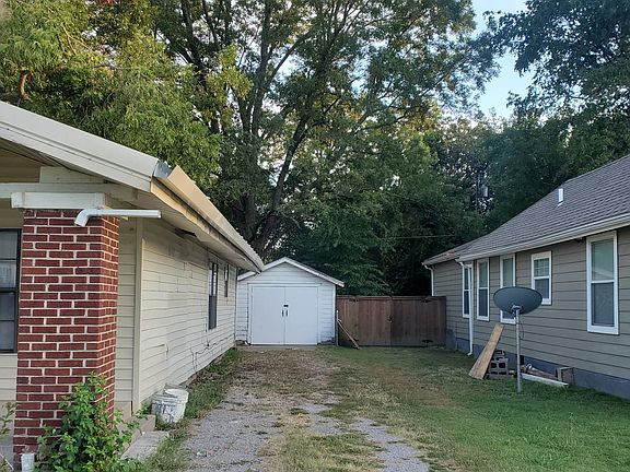 parking space and garage in background