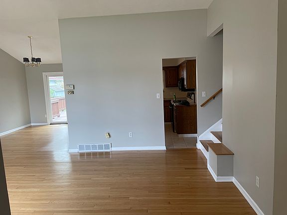 Living room looking into dining room and kitchen