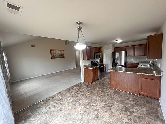 Dining Area with view of Living Room and Kitchen
