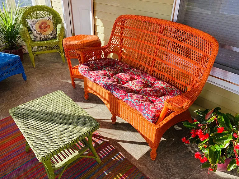 The cheerful and colorful wicker sun porch furnishings remain for tenant usage if desired.