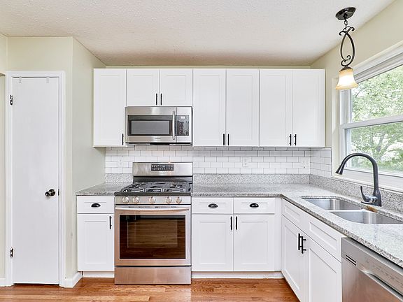 Nice Pantry and custom white cabinet.