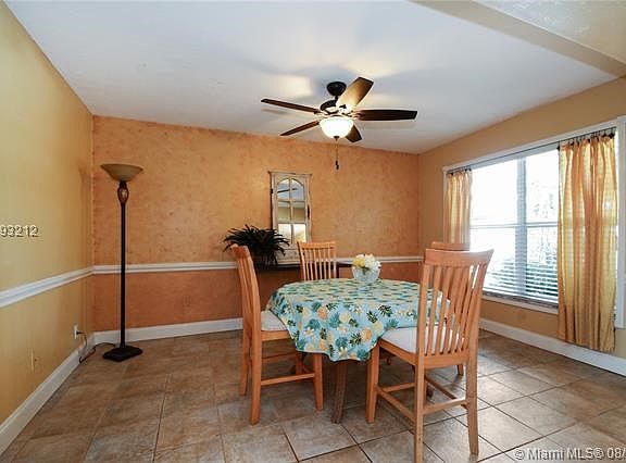 SPACIOUS FORMAL DINING ROOM, FAUX CUSTOM FINISHES W/CHAIR RAIL AND LOTS OF NATURAL LIGHT!