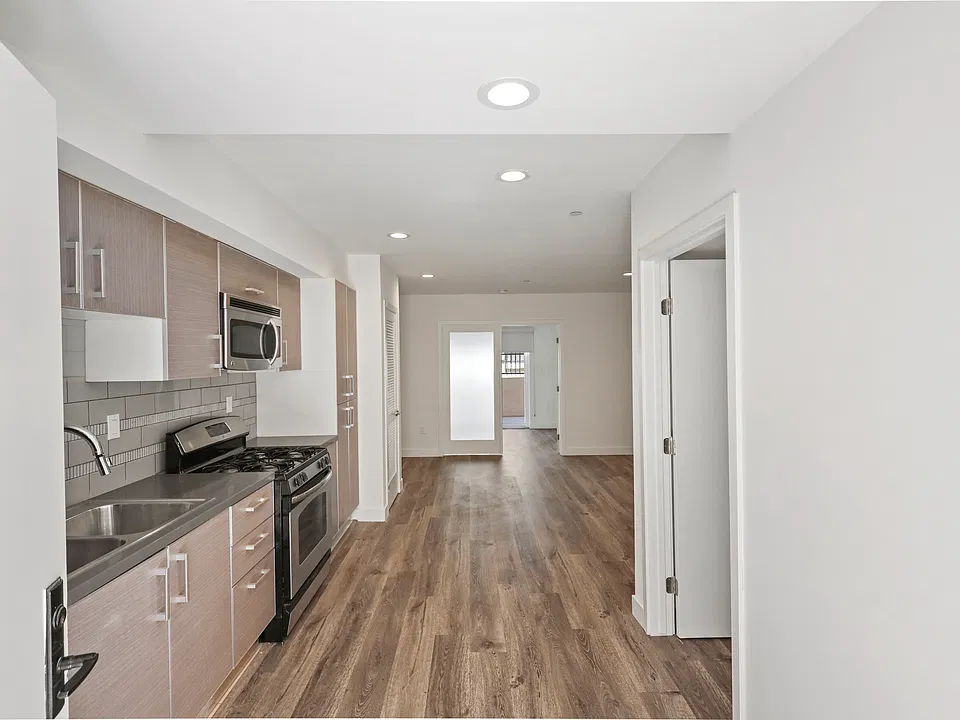 Open-Concept Kitchen with Vinyl Wood Flooring