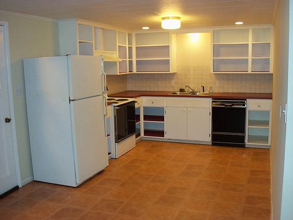 Open concept kitchen. Door on left to utility/storage room.