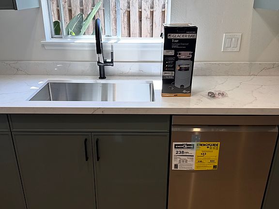 Brand-new kitchen with top-of-the-line LG appliances, quartz countertops, and cabinetry