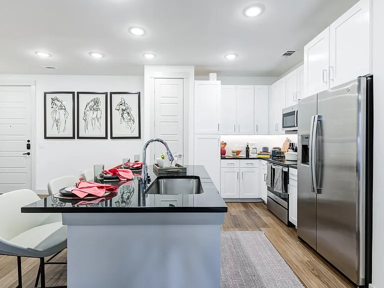 Modern Kitchen With Stainless Steel Appliances and Bar Seating